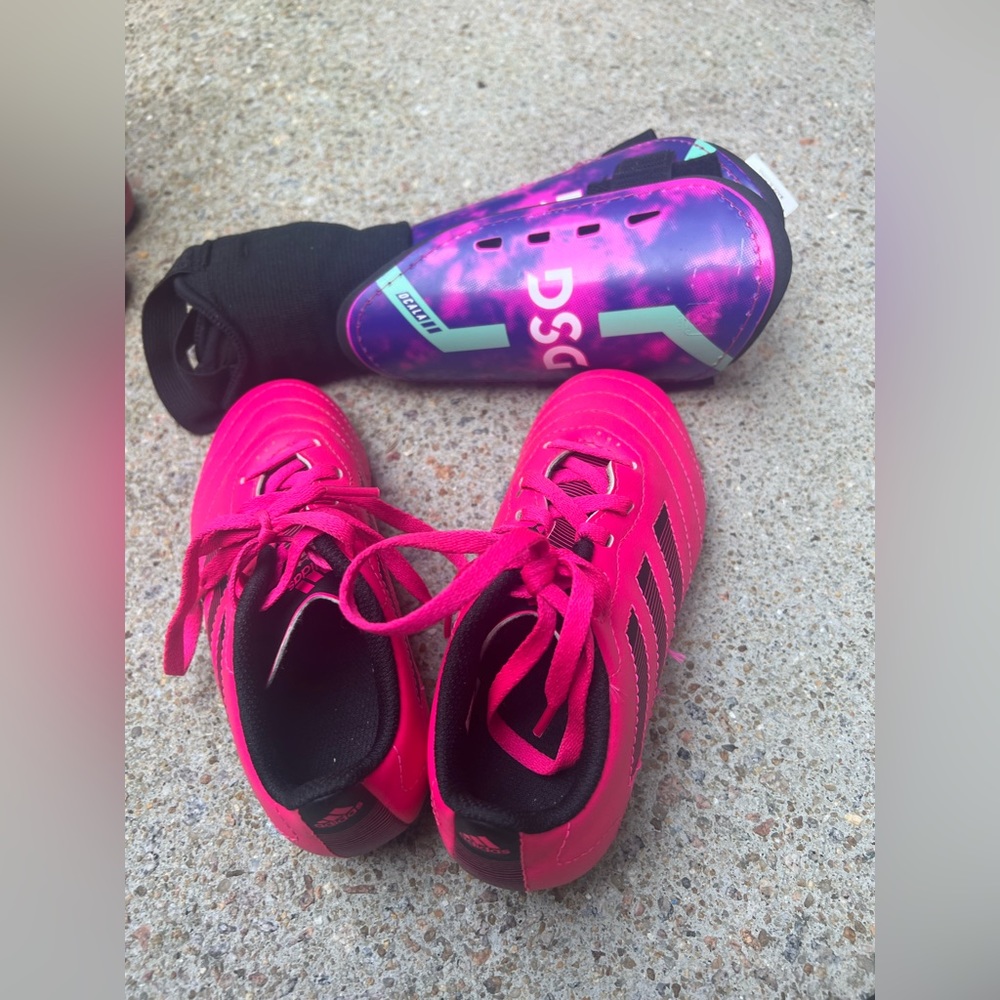 Kids soccer cleats and soccer shin guards.